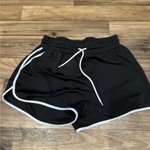 Simple black gym shorts.